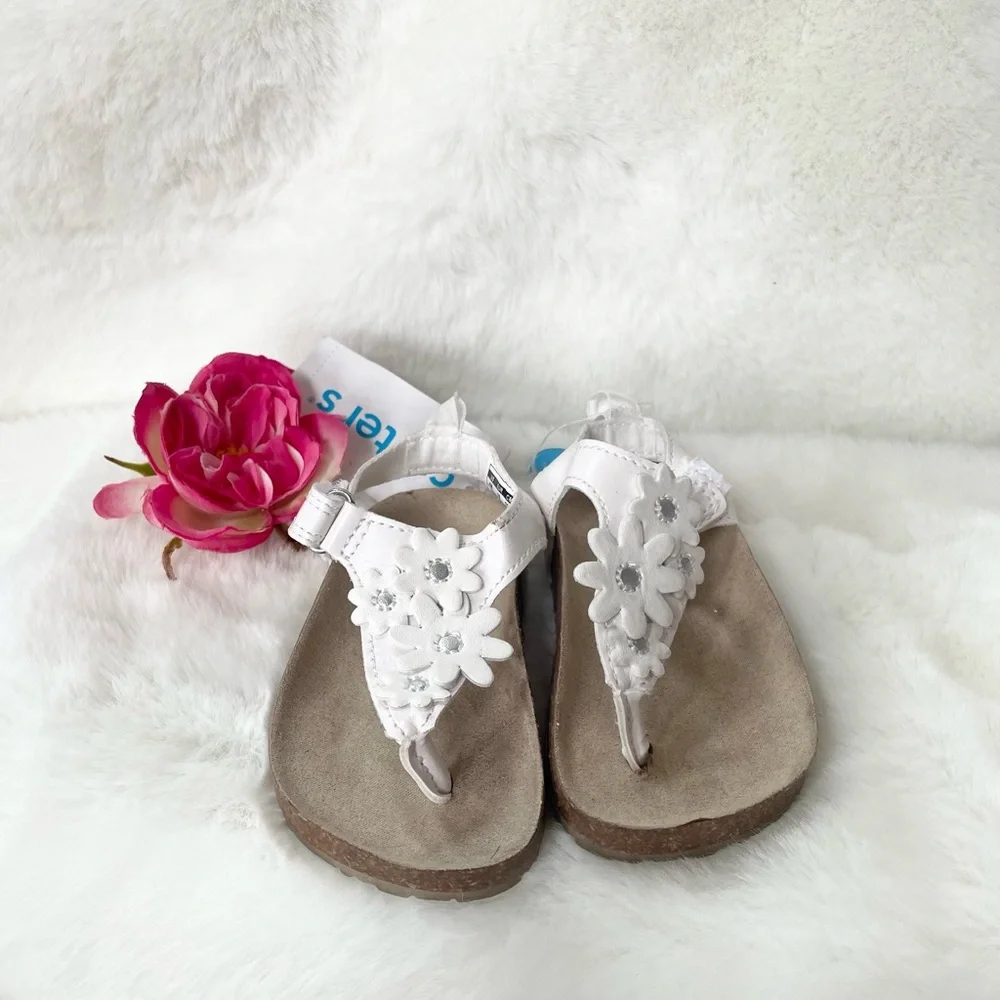 New with tags CARTER’S Toddler’s white Sandals with White Floral Design. Velcro